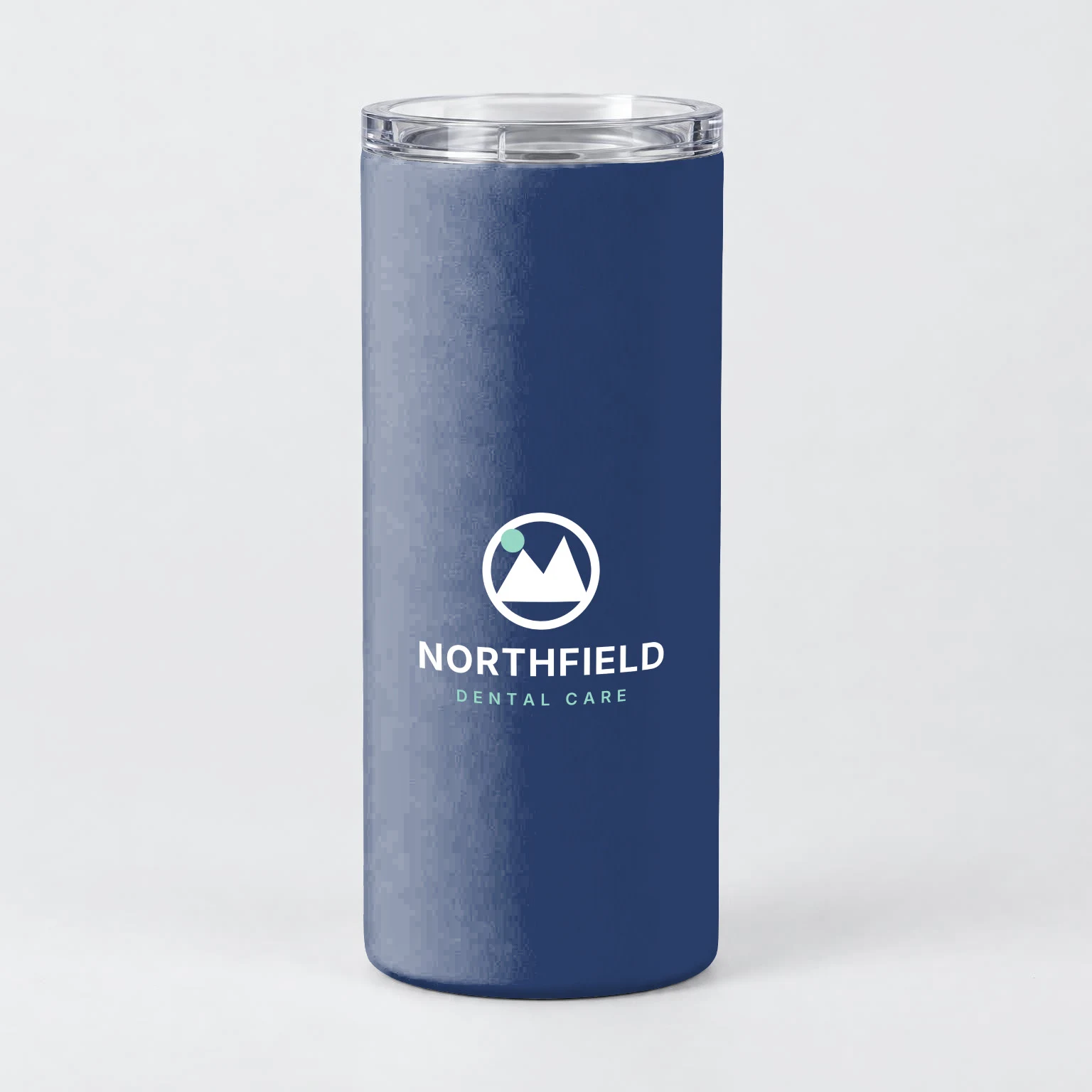 20 oz tumbler recolored navy by SudoMock with the white version of the Northfield Dental Care logo centered on the front of the body, clear lid on top